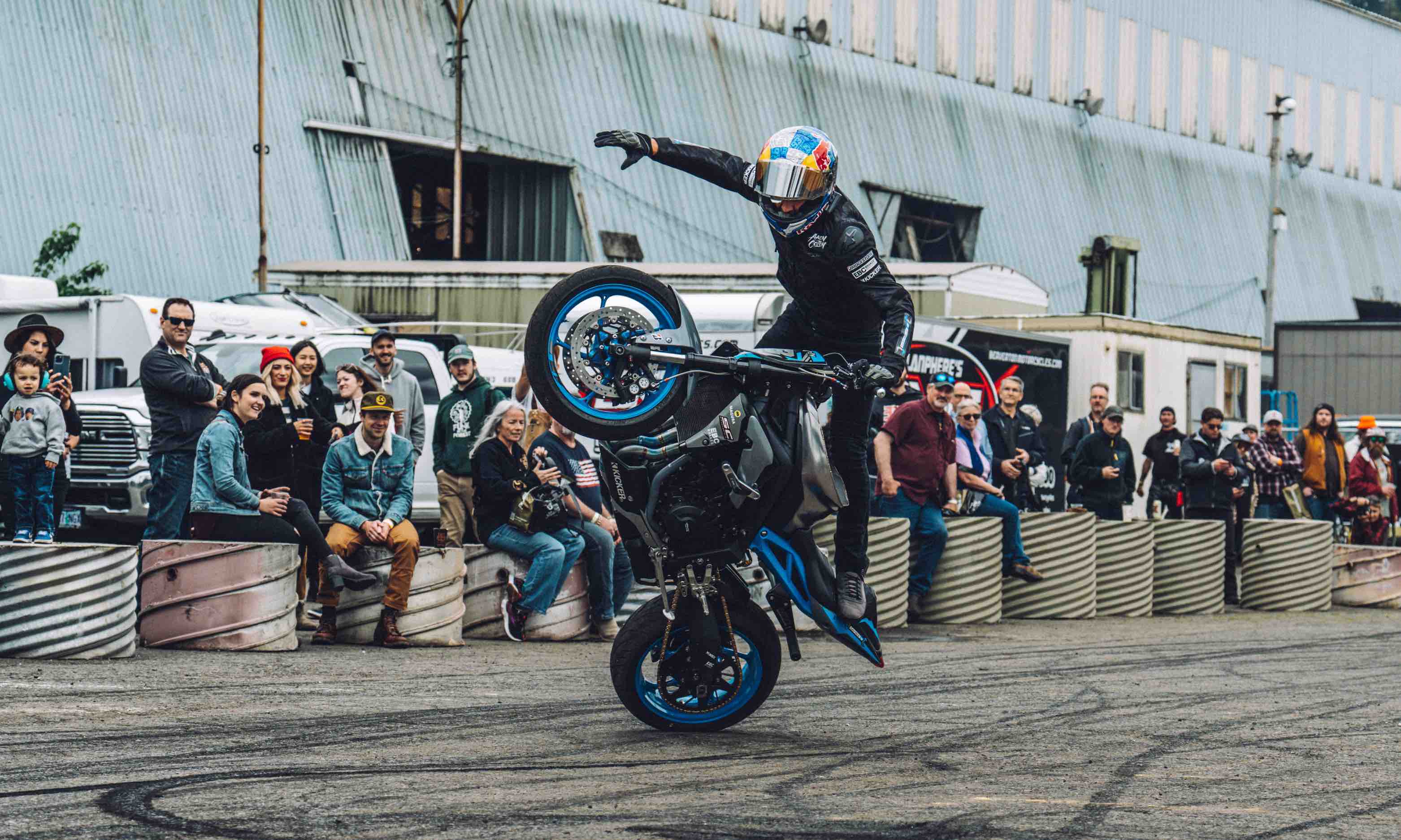 Motorcyclist performing one wheel trick