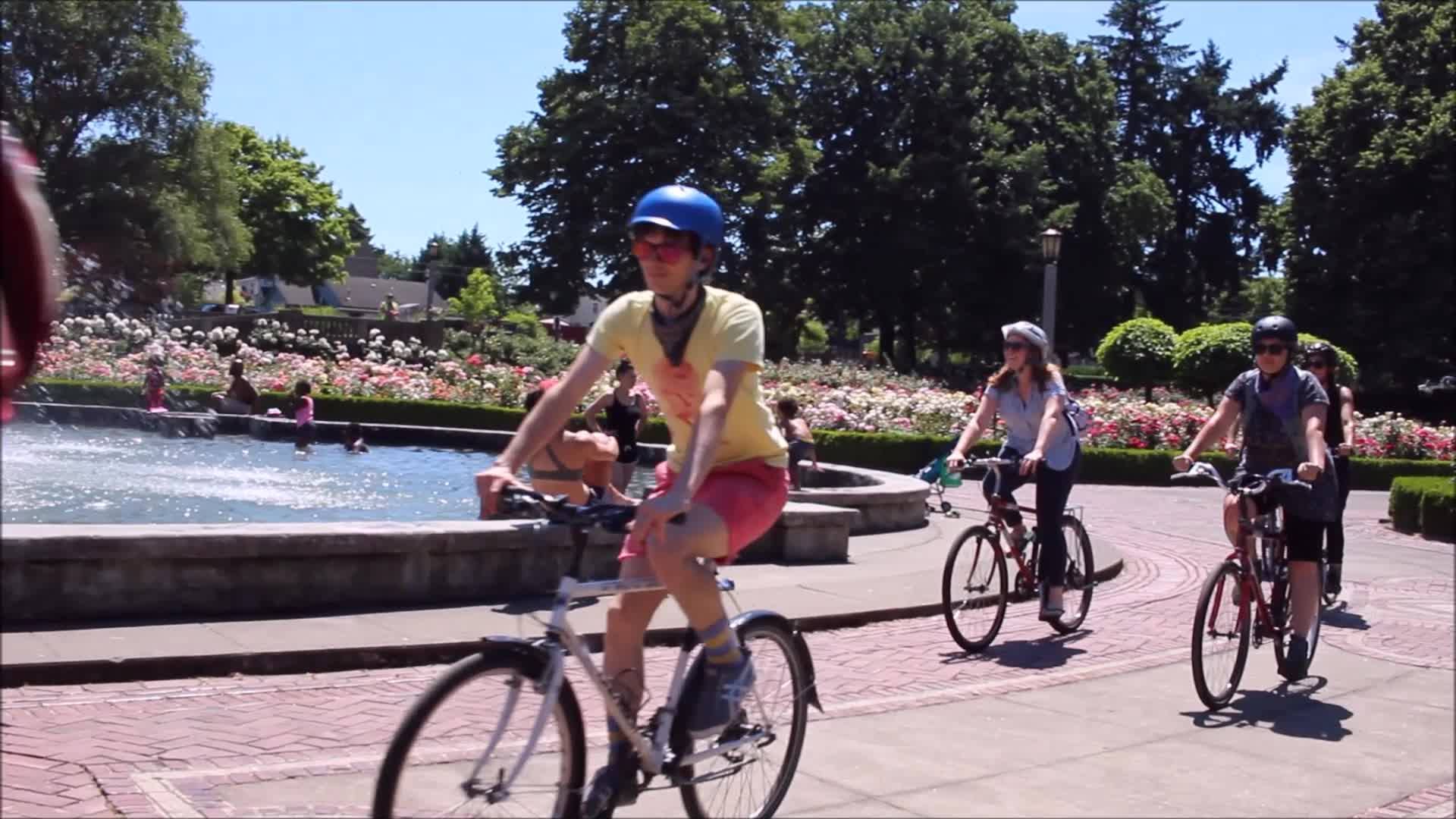 Bike riders around a fountain