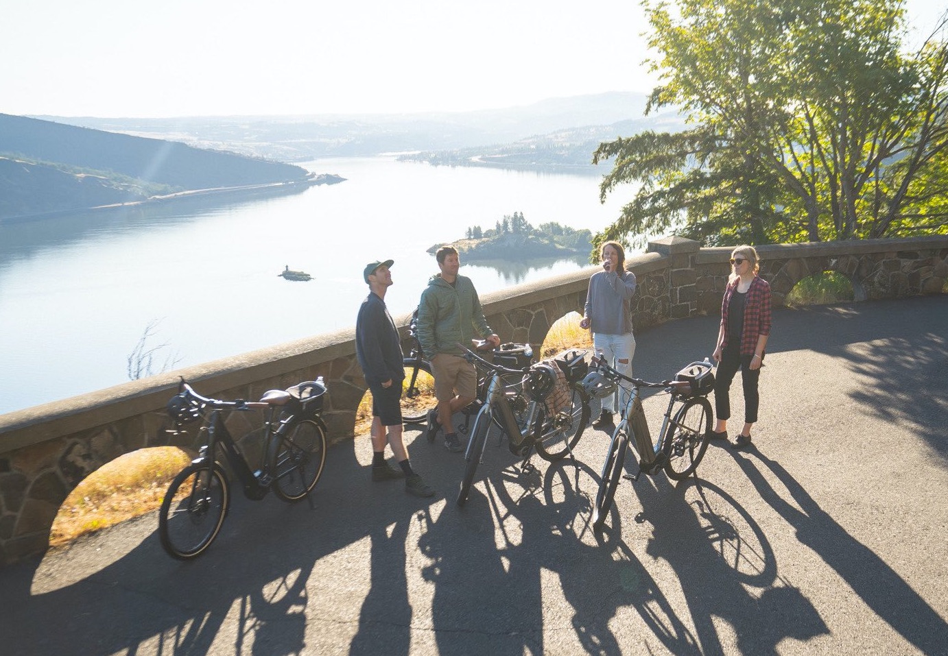 e-bike riders resting at a beautiful viewpoint