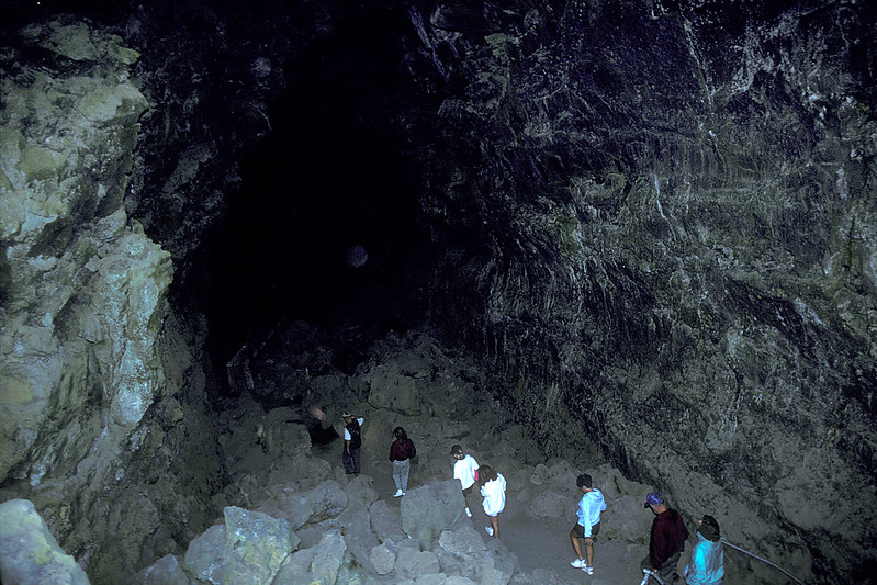 hikers entering lava river cave