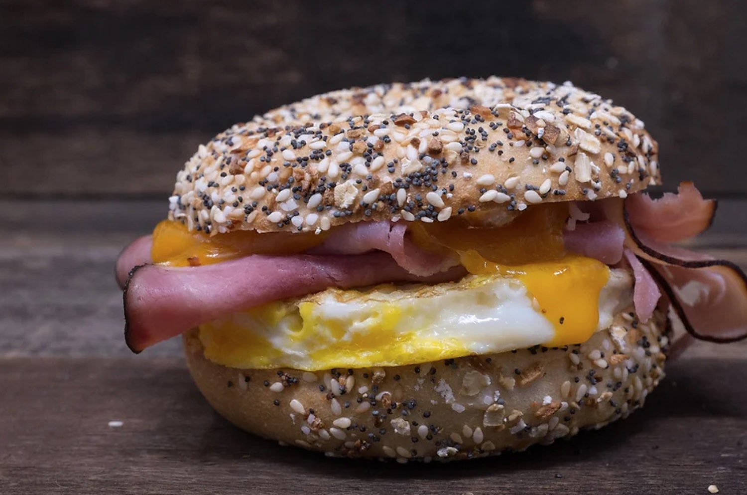 bagel with meat cheese and egg