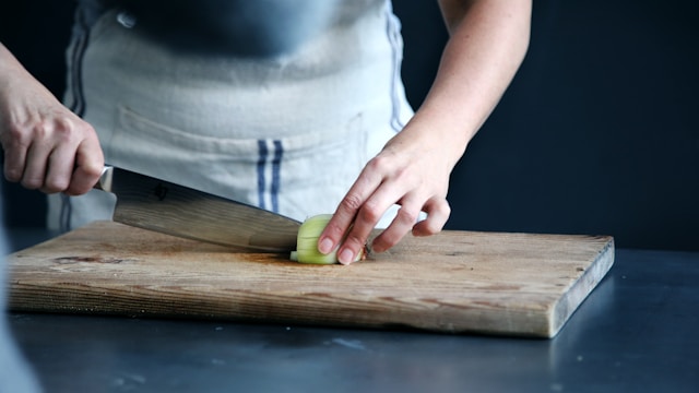 chef cutting vegetable