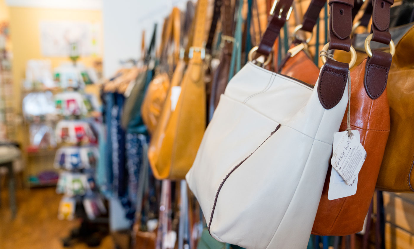 purses hanging in a store