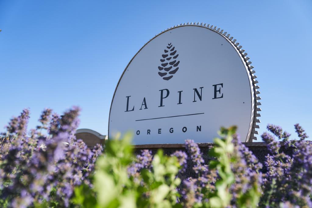 La Pine welcome sign with flowers