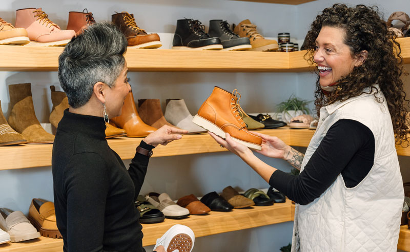 two people discussing boots for purchase
