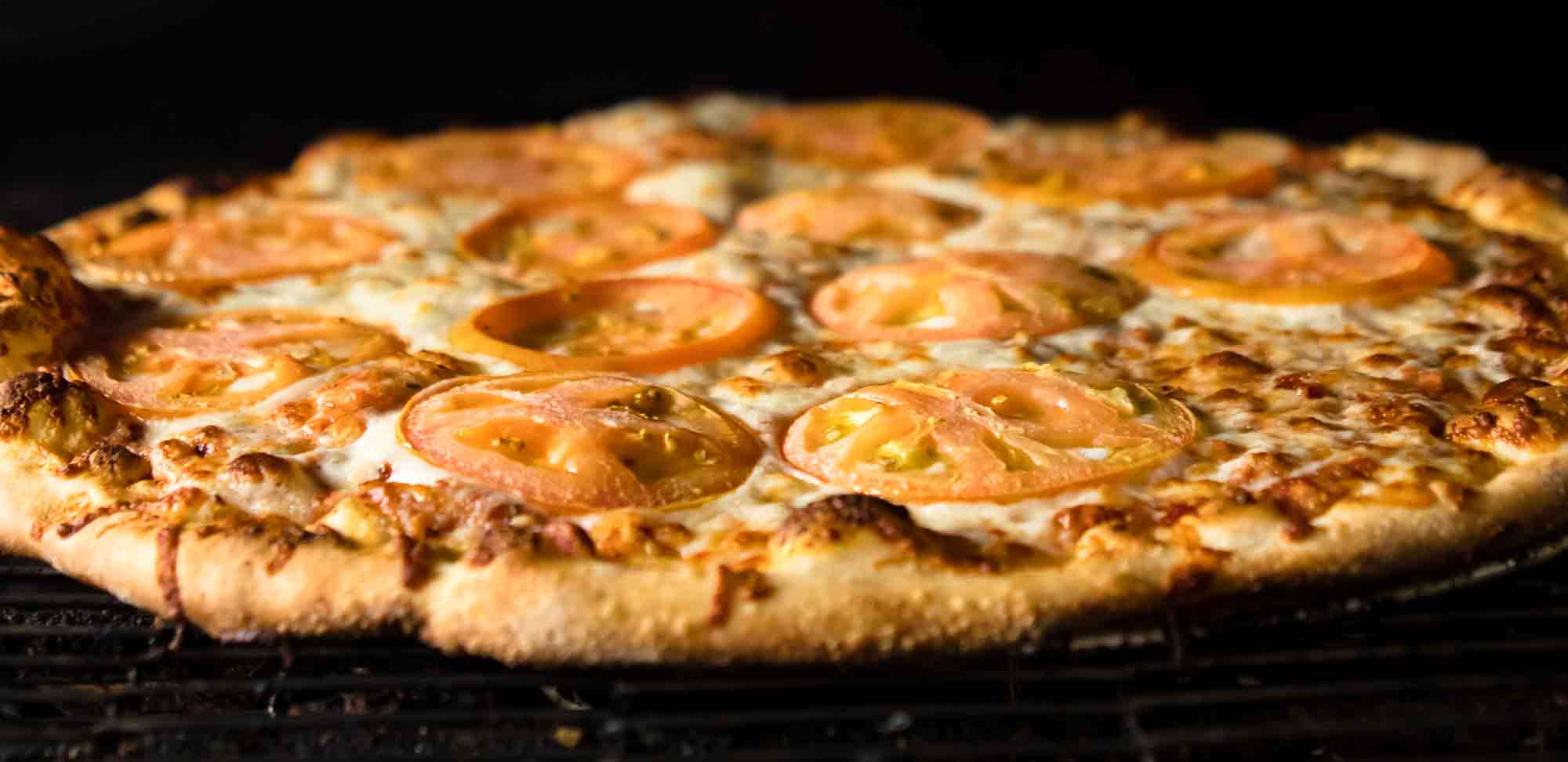 Margherita pizza in the oven at Ivy Bear Pizza