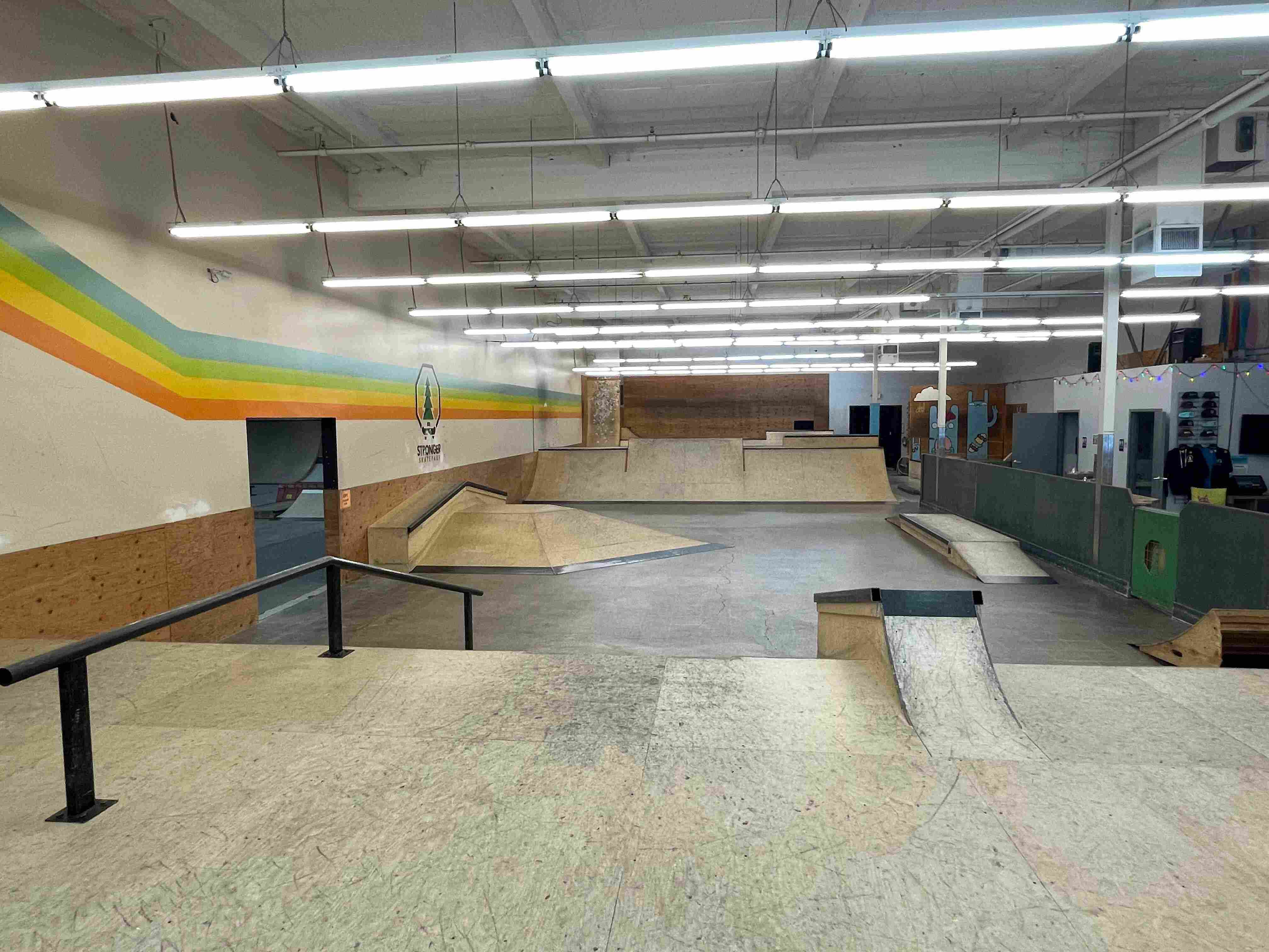 Ramps and rails fill a large open space at Stronger Indoor Skatepark