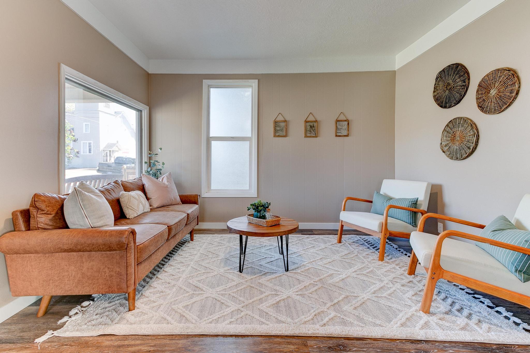 Seating room with a couch across from two armchairs