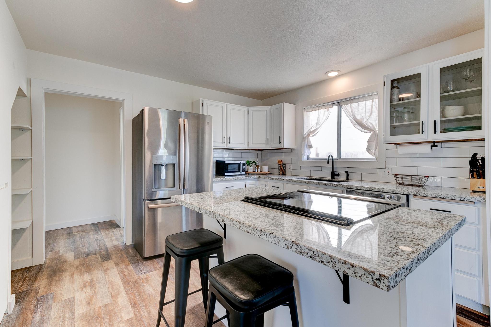 Kitchen with marble countertop island