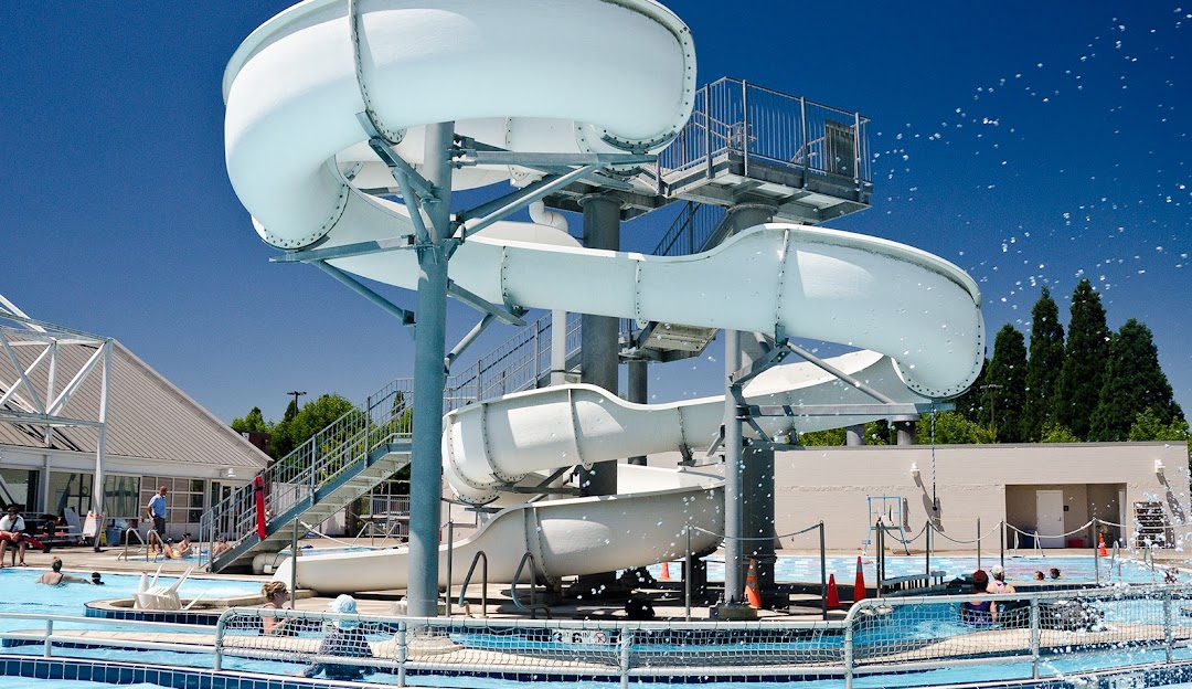big white slide and outdoor pool