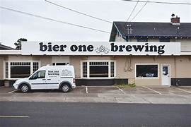 exterior of one story building with sign for bier one brewing