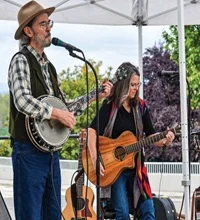 Musicians playing a guitar and banjo