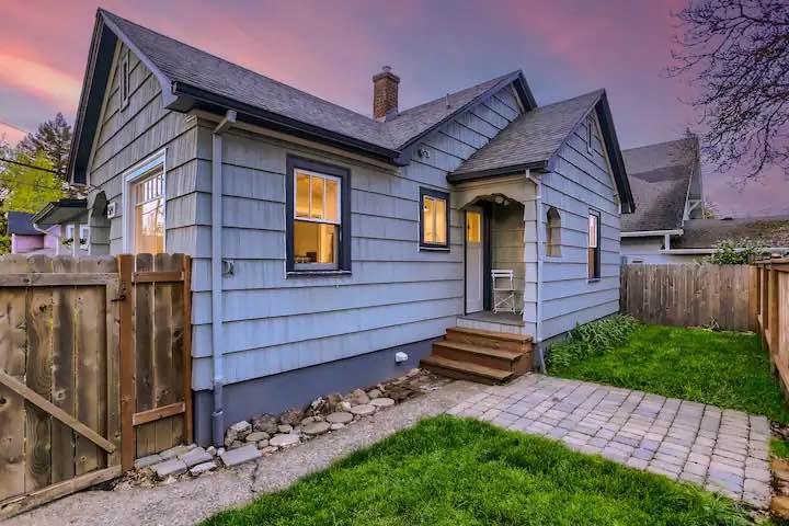Back view of house and yard during sunset