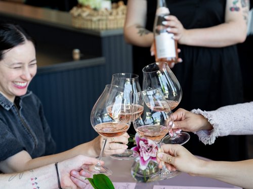 A group toasting their drinks
