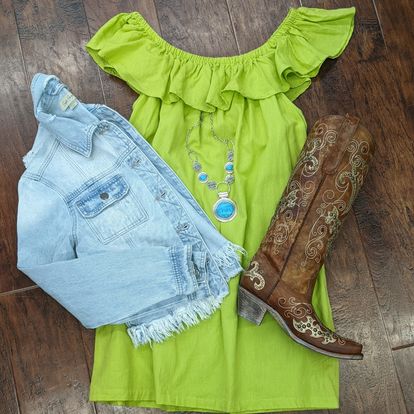 Green dress, boots, and jean jacket.