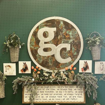 wall display of small baskets and four small horse pictures