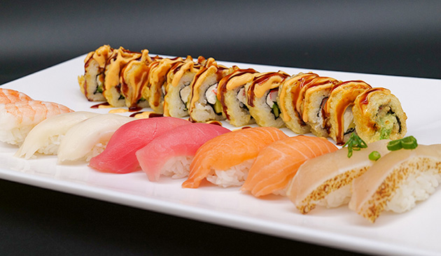 colorful variety of sushi on a white plate