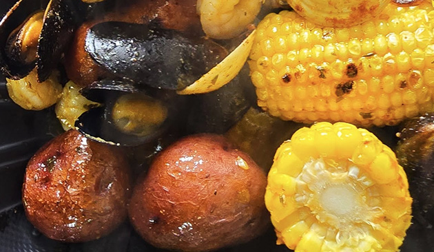 Cajun and creole food with sausage and corn