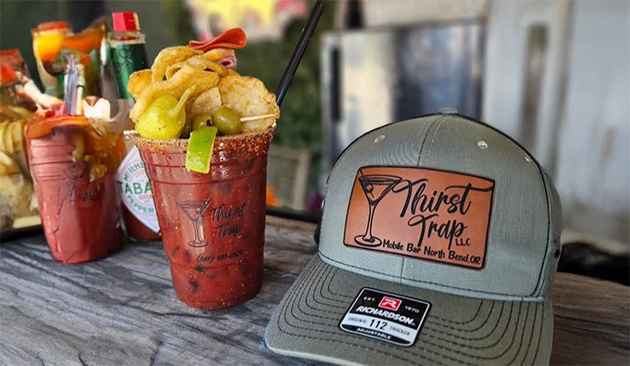 image of 2 bloody mary cocktails and baseball hat
