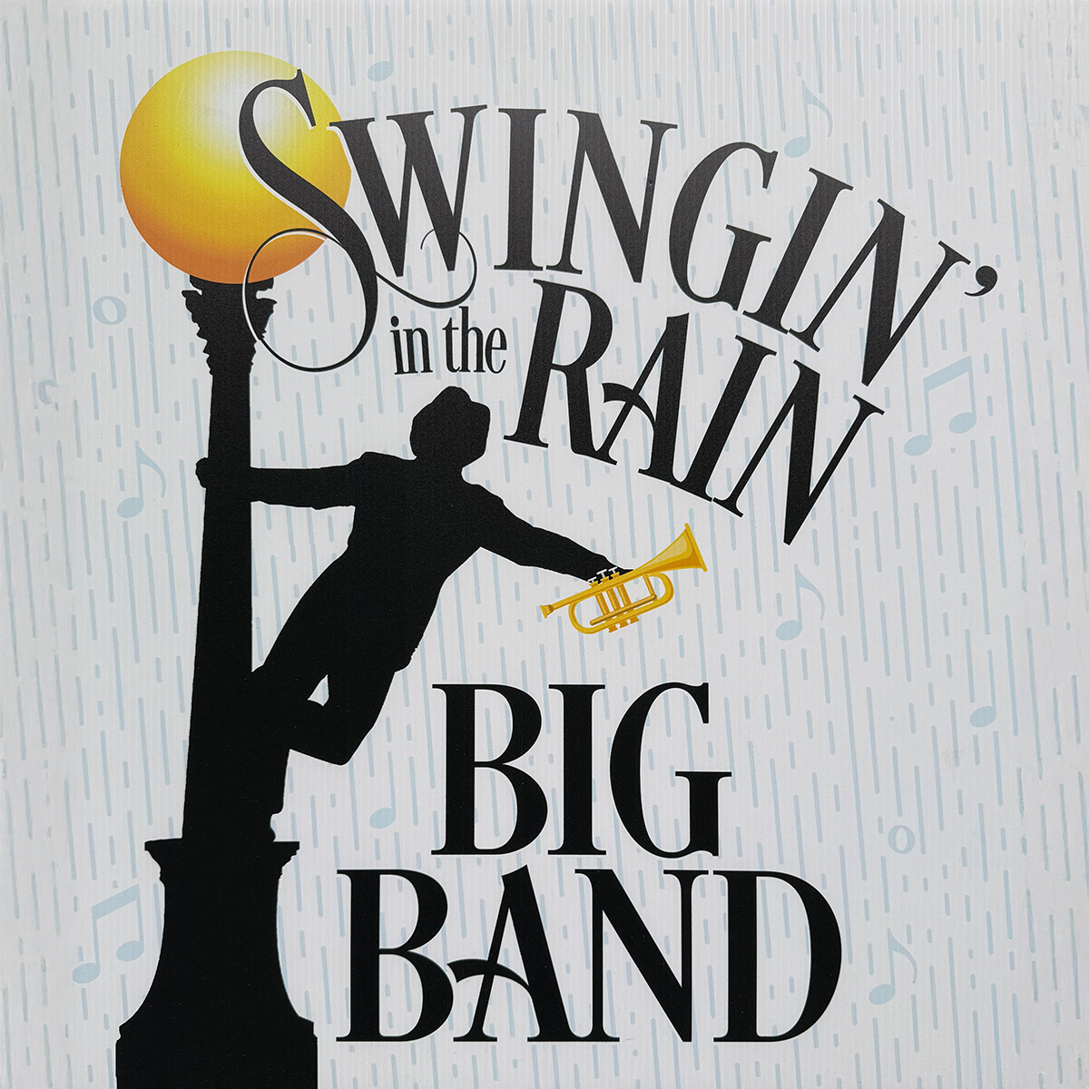 Poster showing a silhouette of a person hanging from a lamppost with a yellow horn, with the text ‘Swingin’ in the Rain Big Band’ against a rainy background