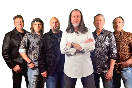 six men standing in a row, aged in 40s 50s and 60s