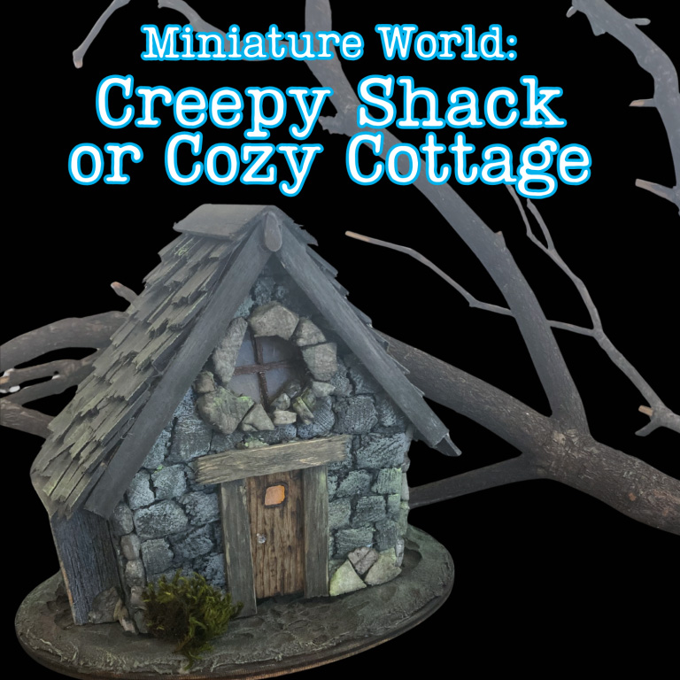 miniature rustic stone cottage near a branch with a black background