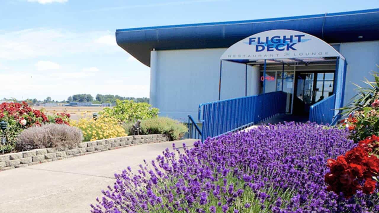 entrance to restaurant with awning and lettering for Flight Deck Restaurant & Lounge