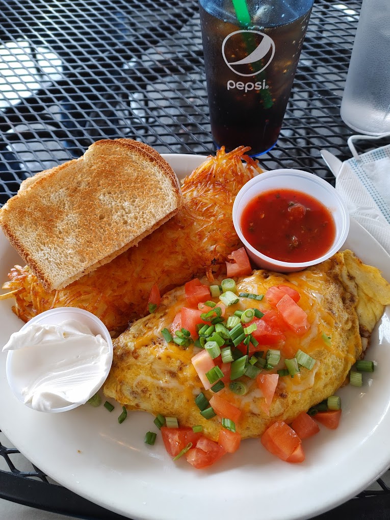 omelet, hashbrowns and toast with side of sour cream and salsa