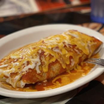 burrito smothered in sauce and melted cheese