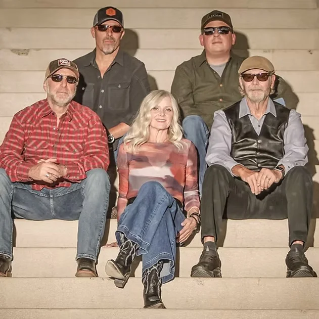 Band Members sitting together on stairs