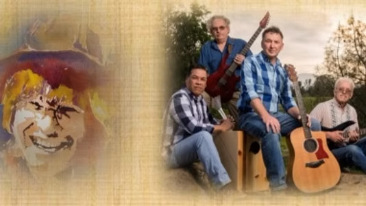 The band members posing with instruments