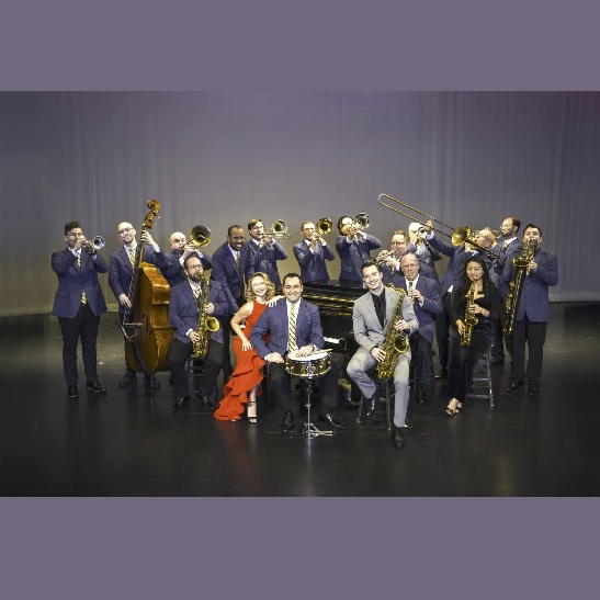 Glen Miller Orchestra with several members in purple suits, holding their instruments