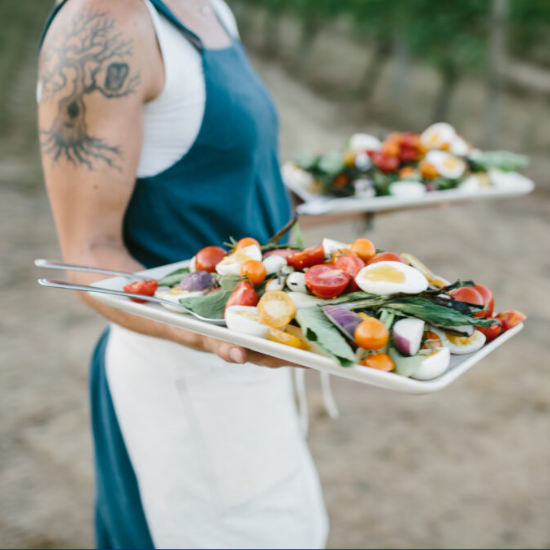 Person carrying two trays of food