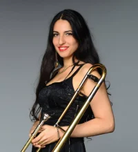 Nani Vazana holding a trombone