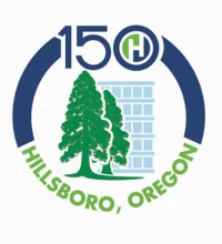 Two trees with rign around them with "150 Hillsboro, Oregon" aaround it