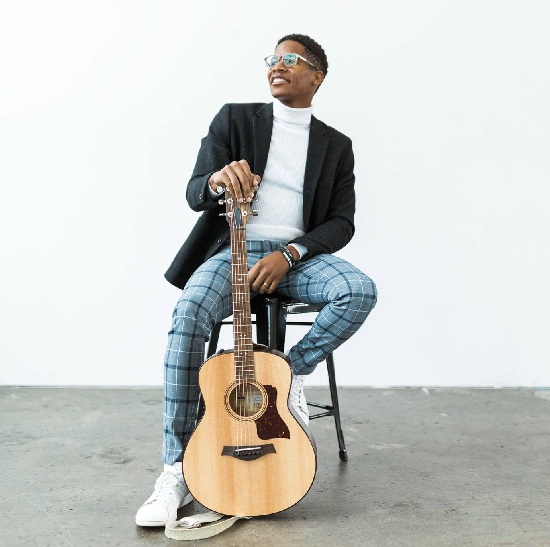 Thunderstorm with a guitar, sitting on a stool
