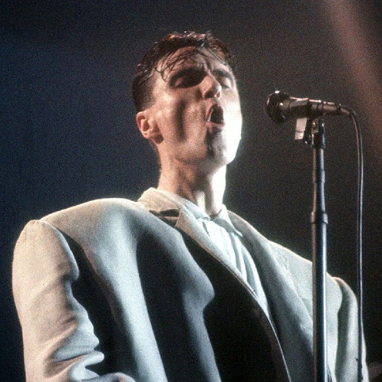 Talking Heads lead singer with a blazer on