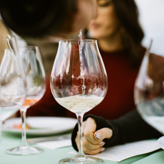 White wine being poured into a glass