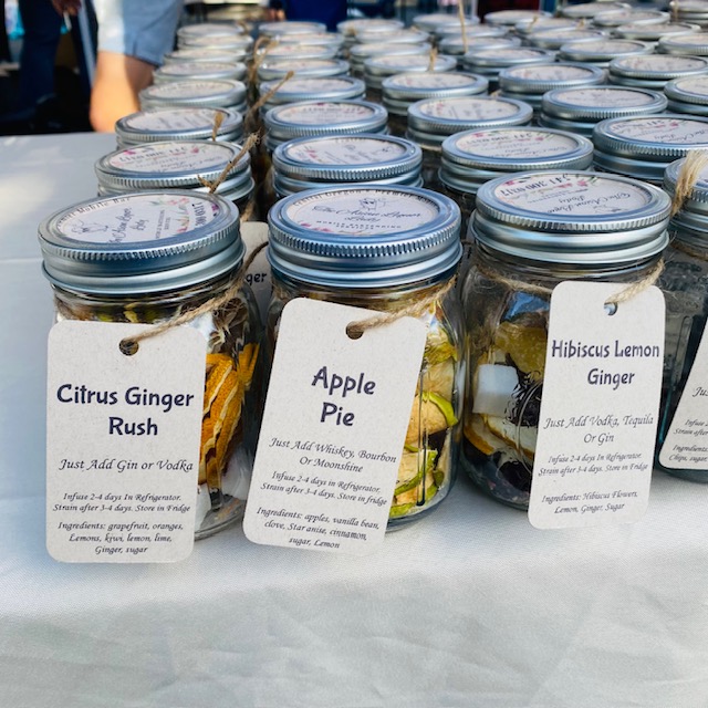 Jars filled with various ingredients for handmade cocktails