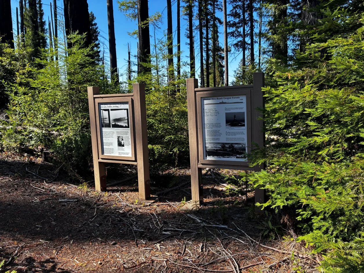 Interpretive signs in forest.