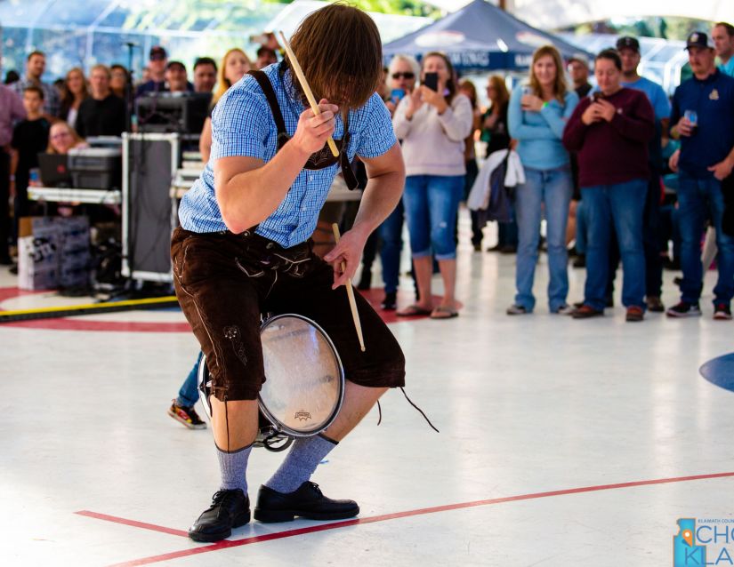 A performer exhibiting a German drum!