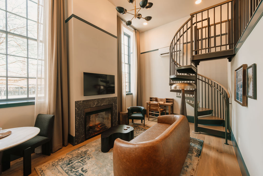 A room with a spiral staircase in The Westman Hotel in Bend, Oregon