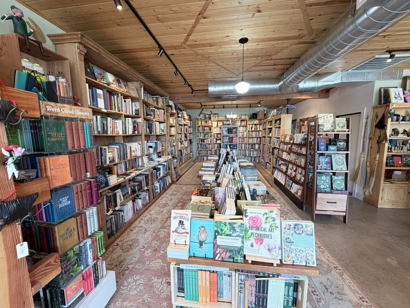 Shelves of books in a book store retail display.